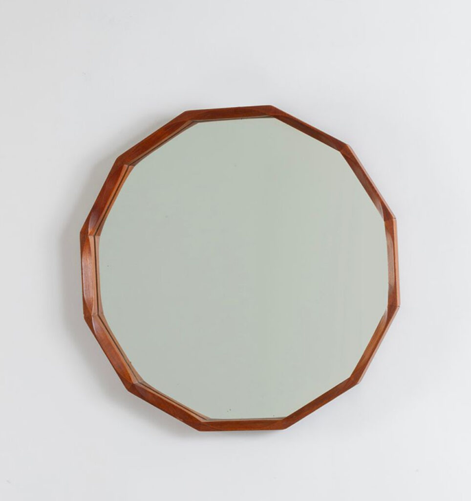 An Italian teakwood mirror, circa 1960.