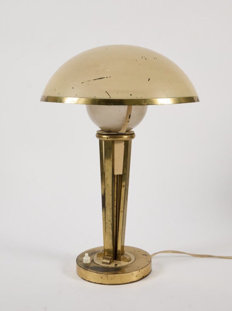 A  swivel brass table lamp by Jacques Adnet.