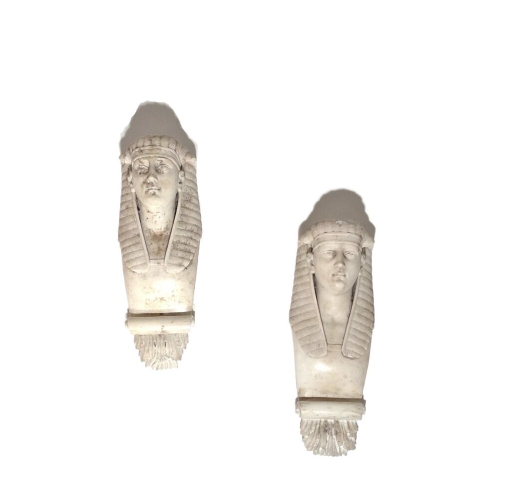 A pair of 19th century carved white marble sconces.
