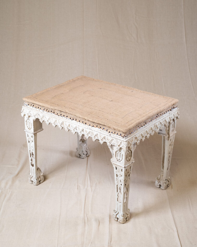 A painted stool with Gothic arcading.
