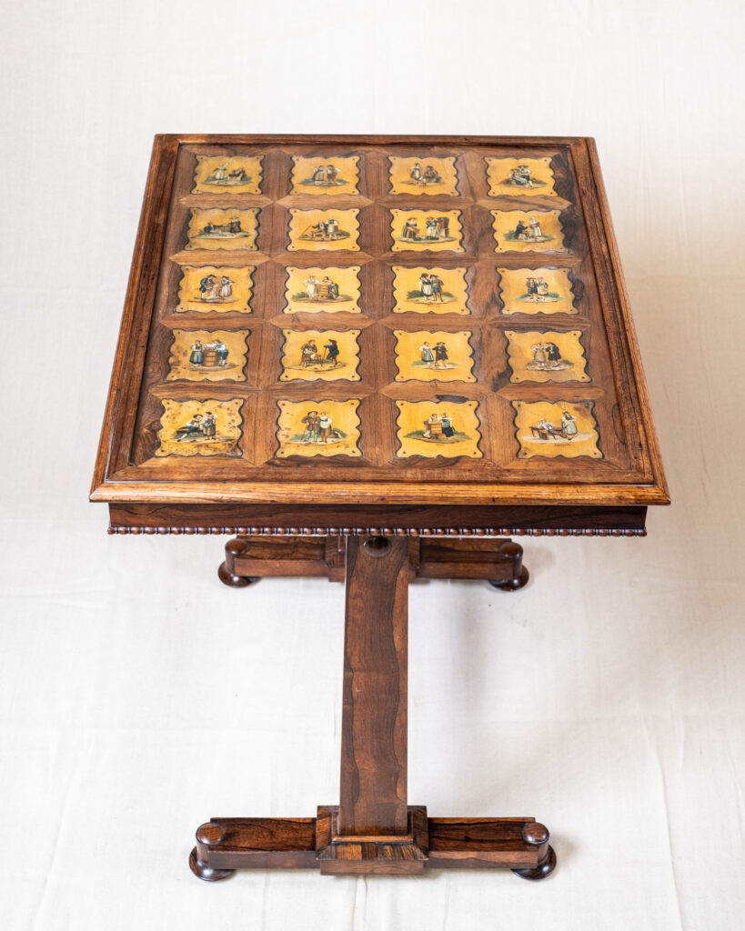 A William IV rosewood table with a Swiss painted top, twenty canton figure vignettes.