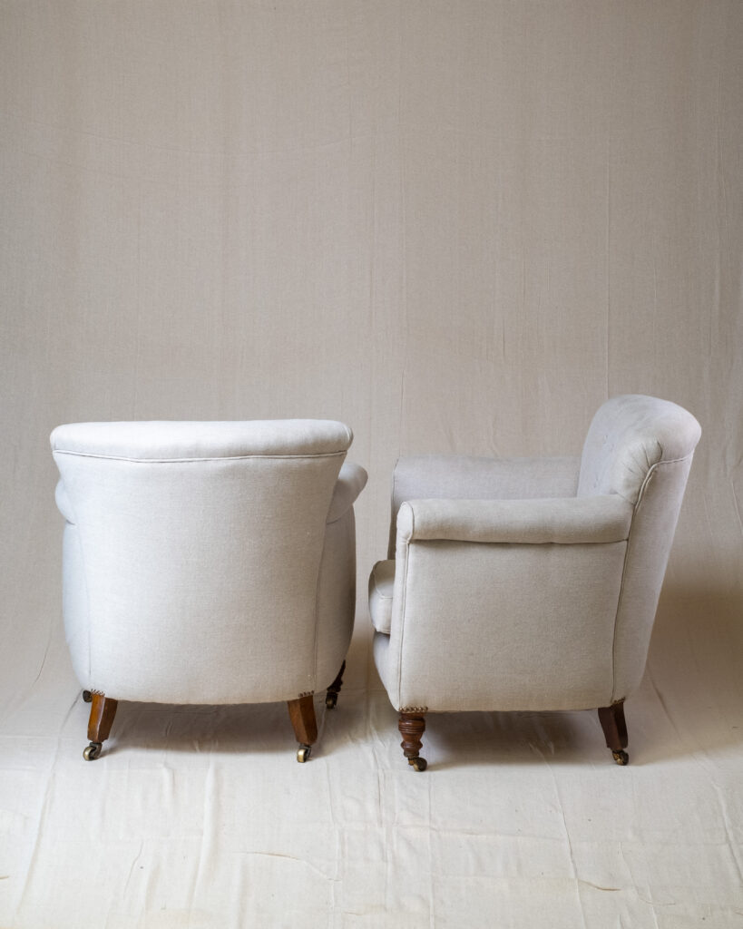 A pair of upholstered armchairs.