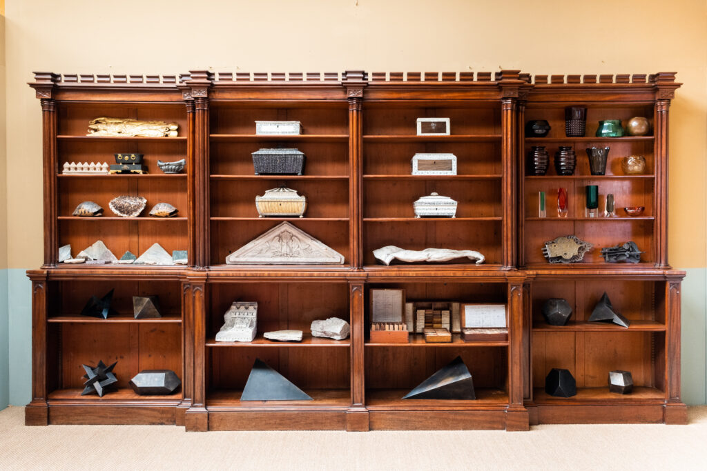 A large architectural bookcase with columns.