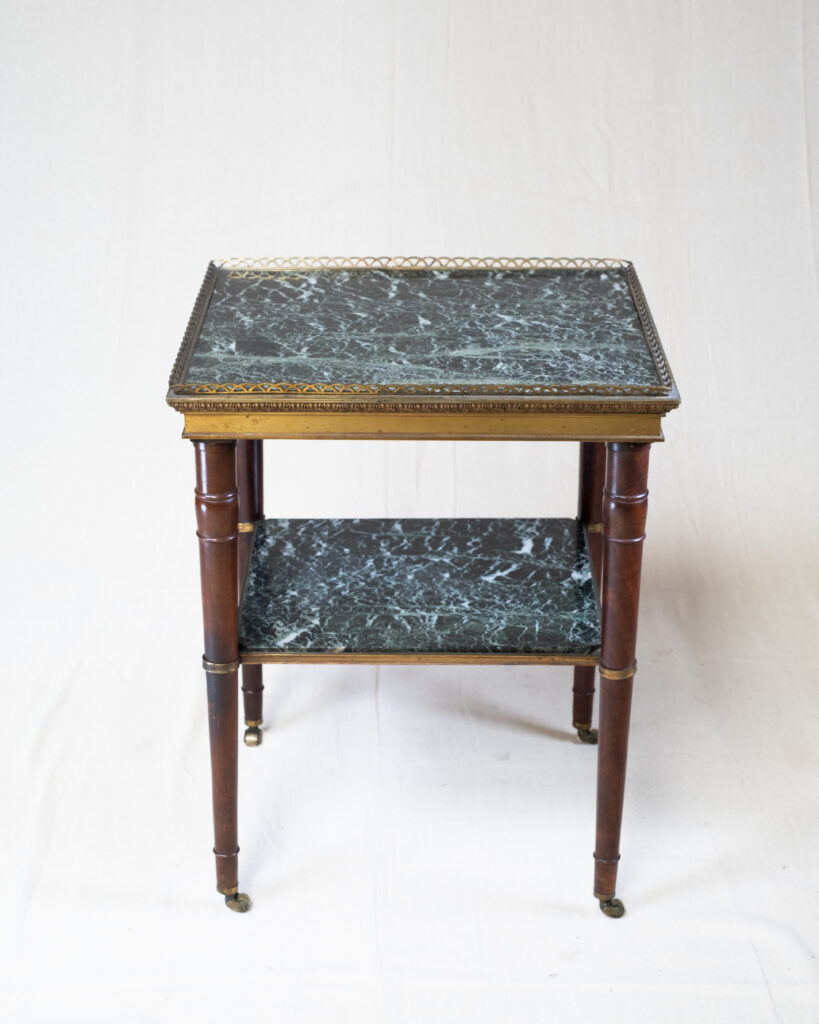 A French two tier occasional table.