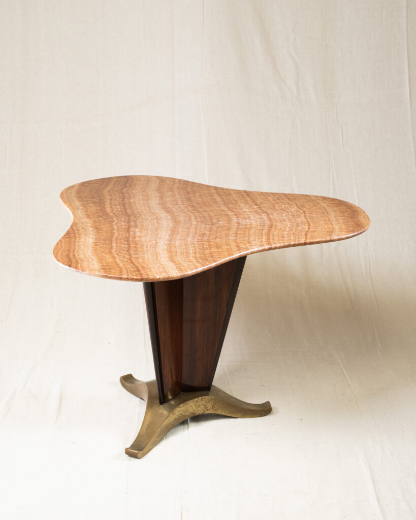 An Italian occasional table attributed to Cesare Lacca, hardwood, brass and marble, circa 1940.