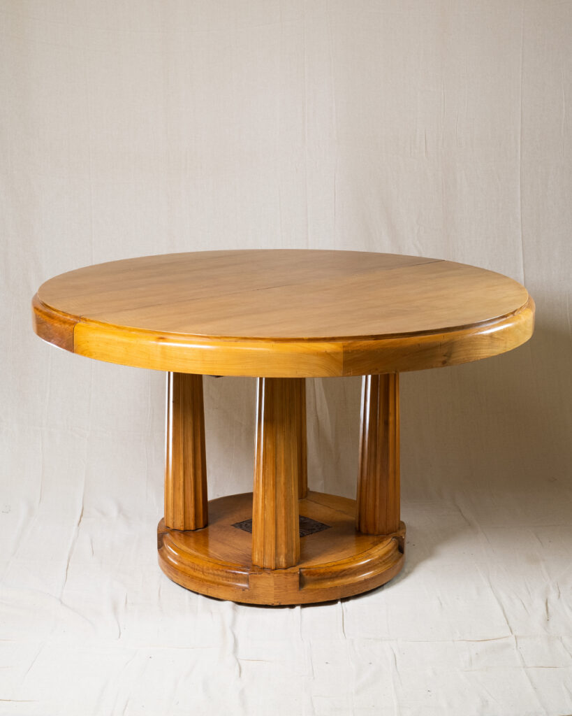A cherrywood French Art Deco dining table.