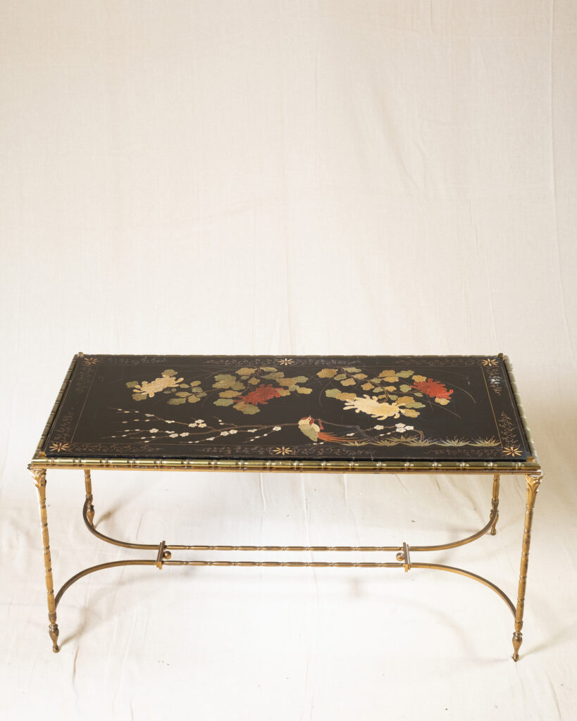 A lacquered coffee table by Maison Baguès.